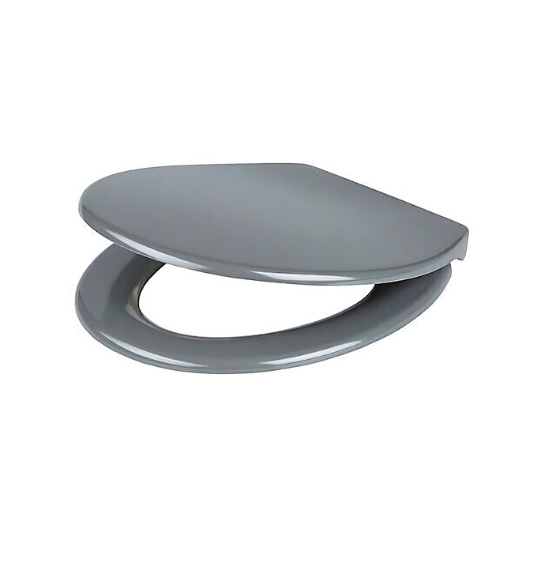 White toilet with a gray seat against a tiled bathroom wall.