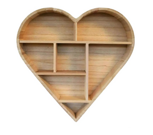 Wooden heart-shaped shelf with multiple compartments on a white background
