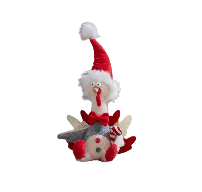 A plush toy turkey with a Santa hat and decorative bow, displayed on a festive setting, presumably part of holiday decor.