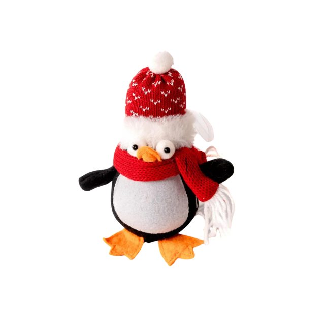 Knitted penguin ornament with a red hat and scarf on a Christmas tree.