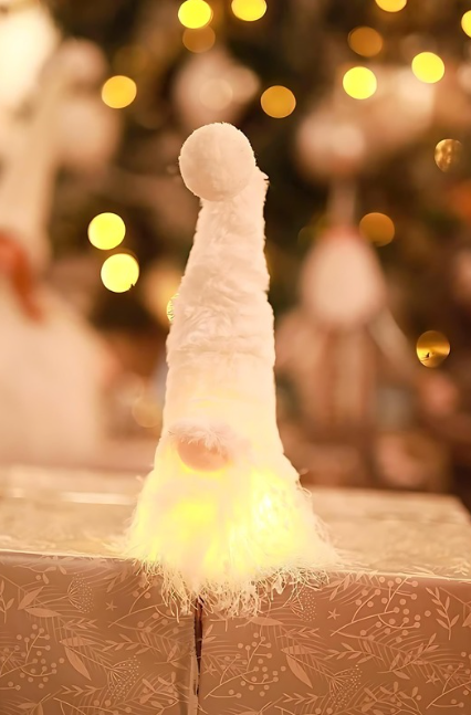 Decorative item resembling a unicorn horn on a box with blurred lights in the background