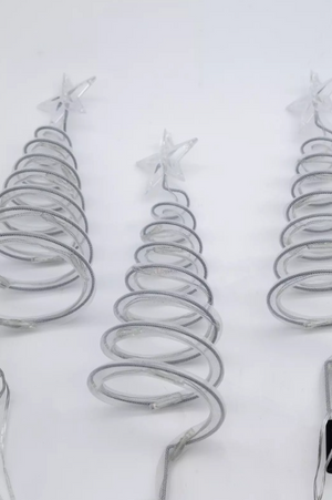 Metallic spiral Christmas tree decorations on a white background