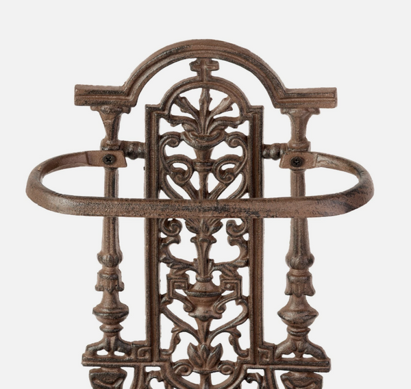 Decorative metal wall hook with intricate designs on a white background