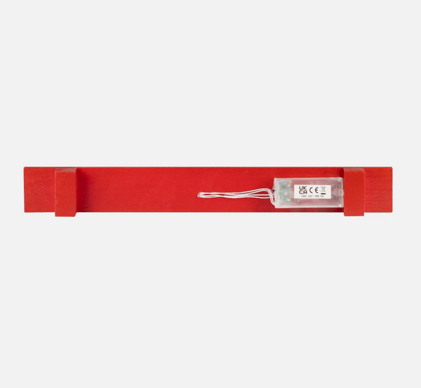 Red belt with a label on a white background