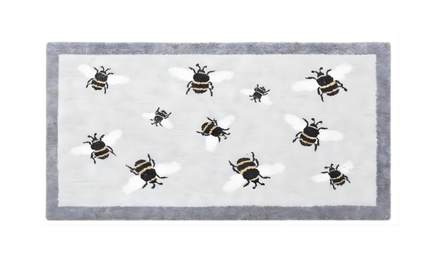 Rectangular rug with bee pattern on a white background