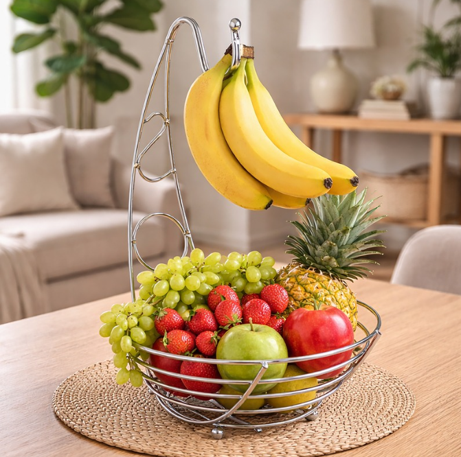 Fruit basket with bananas, grapes, strawberries, and a pineapple on a table in a living room.