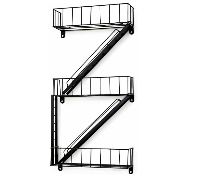 Black metal wall shelf with decorative items in a living room setting