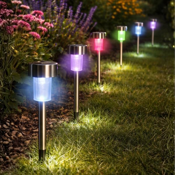 Solar-powered garden lights emitting colorful lights on a grassy area with flowers.