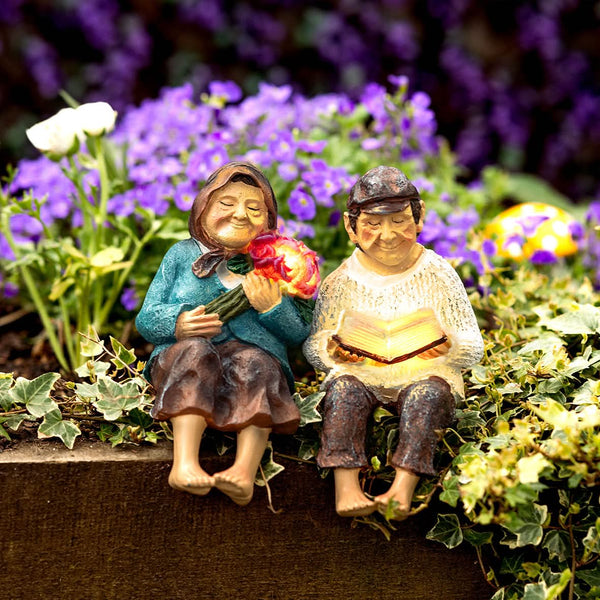 Solar powered garden couple statues