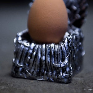 Stone effect throne egg holder for collectible tableware