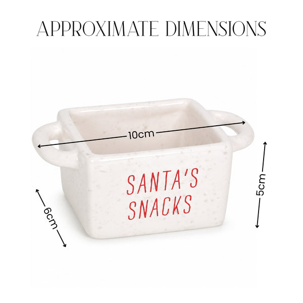A small white speckled ceramic container with side handles and red 'SANTA'S SNACKS' text, shown with dimension arrows and labels reading 10cm, 6cm, and 5cm, under the heading 'APPROXIMATE DIMENSIONS'.