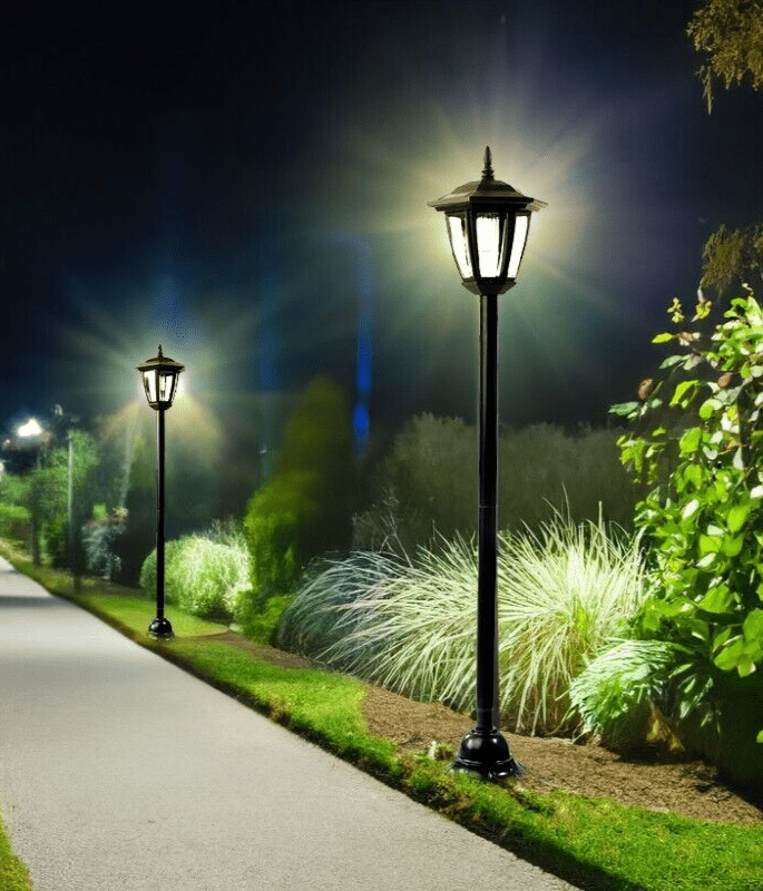 Solar powered Victorian lamp post illuminating garden pathway