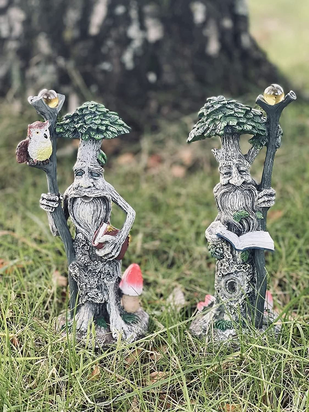 Tree man garden ornaments attached to outdoor tree trunk