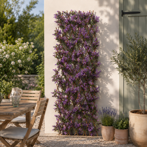 Artificial foliage and violet flower wall trellis