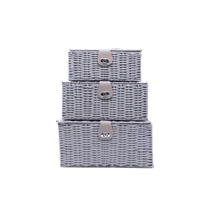 Set of three gray wicker baskets with metal clips on a white background