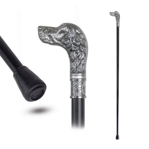 A black walking cane shown from multiple angles on a white background, including a close-up of the black rubberized grip and a full-length view of the cane with an ornate silver-toned dog-head handle and decorative band.