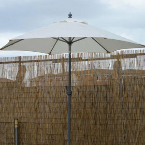 Weather-resistant cream patio umbrella for outdoor spaces