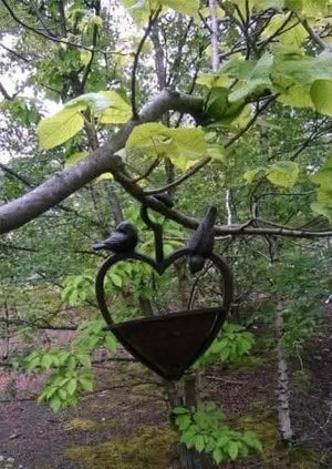 Weatherproof hanging bird feeder for outdoor spaces