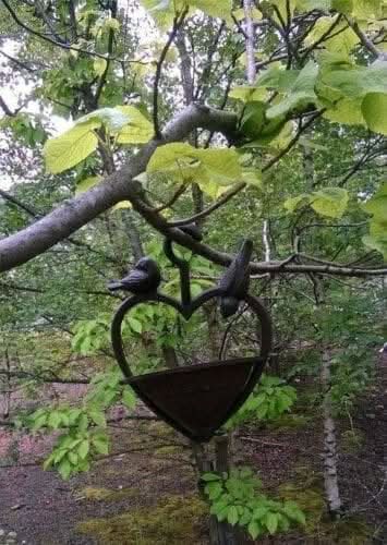 Weatherproof hanging bird feeder for outdoor spaces