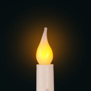 Flickering candle light bulb on a dark background