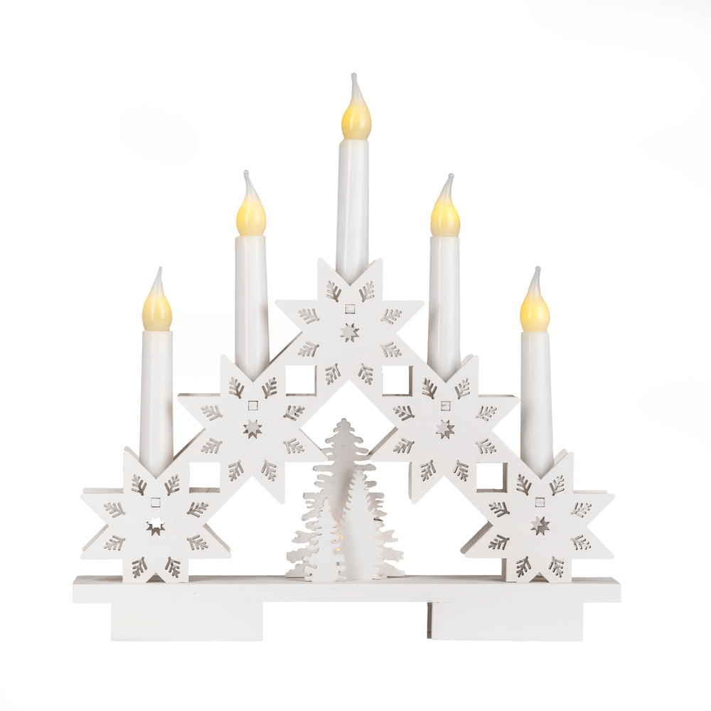 Decorative candle holder with lit candles on a dark background