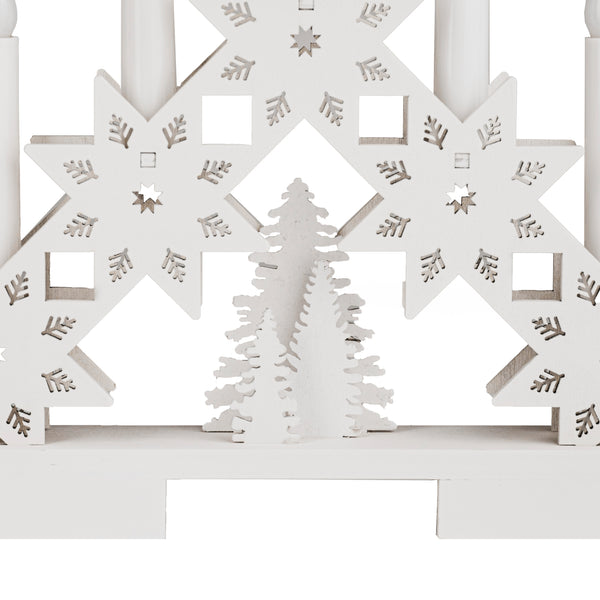 White decorative panel with cut-out star shapes and a tree silhouette on a white background
