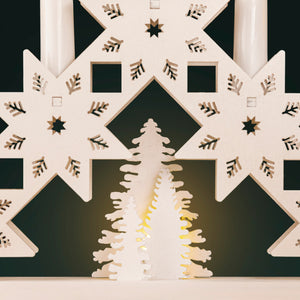 Decorative wall art with geometric patterns and cut-out designs on a black background