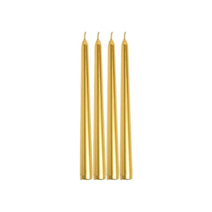 Four slim gold taper candles standing upright side by side on a plain white background.