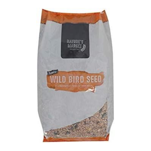 A bag of Nature's Market Wild Bird Seed, featuring a gray paper bag with orange accents and a clear window at the bottom showing the birdseed inside.