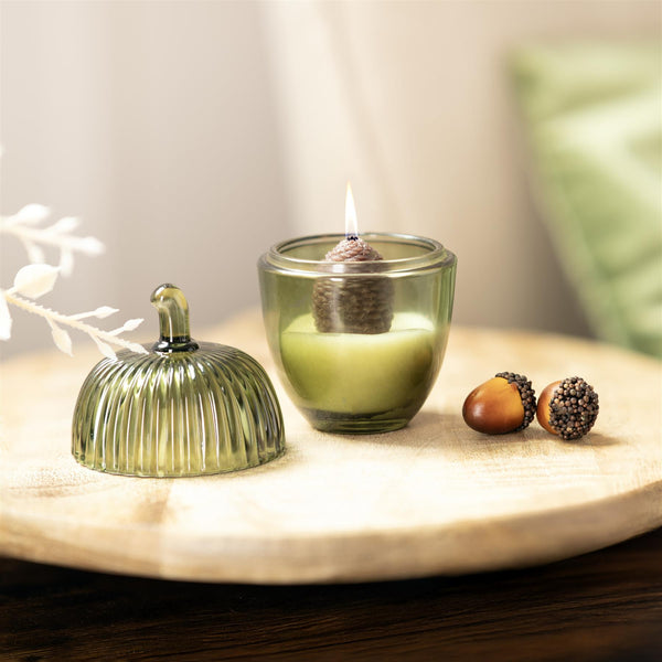 Acorn shaped scented candle displayed on a mantelpiece