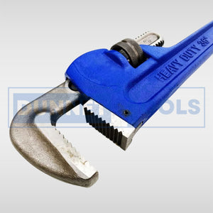 Heat-treated adjustable wrench gripping a metal pipe.