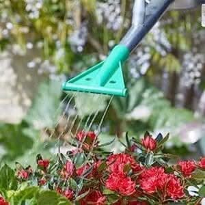 Adjustable weed and feed watering can nozzle