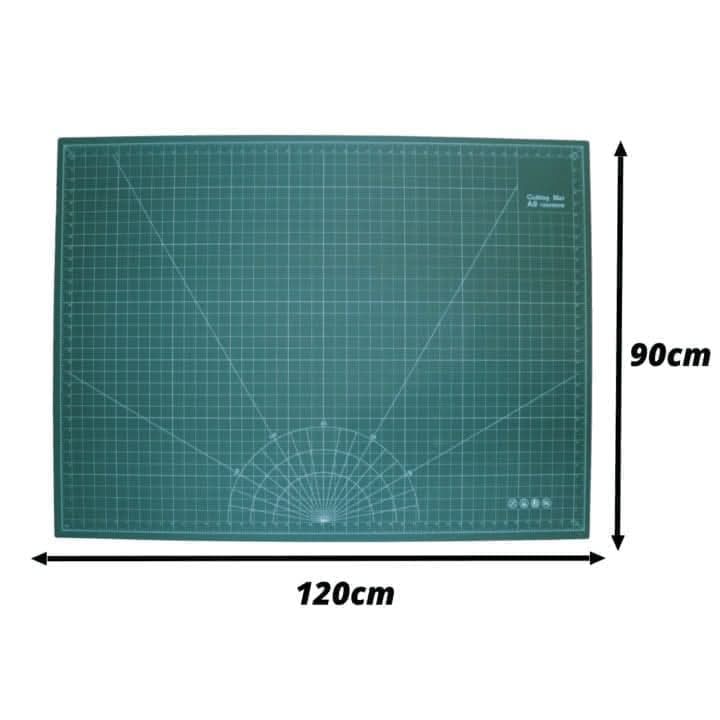 A green A0 cutting mat with grid lines, marked with centimeter increments.