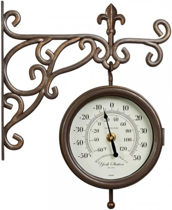 Antique station clock displaying time and temperature