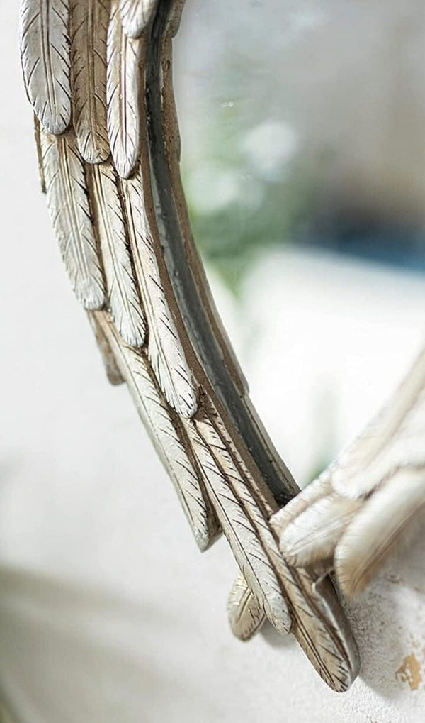 Antiqued silver angel wing decorative mirror