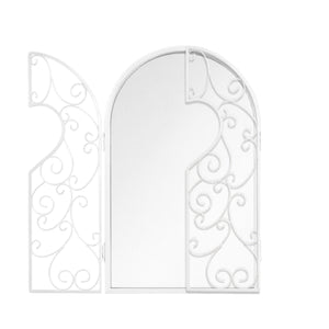 Decorative metal mirror displayed on an interior wall