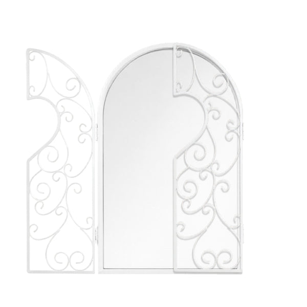 Decorative metal mirror displayed on an interior wall