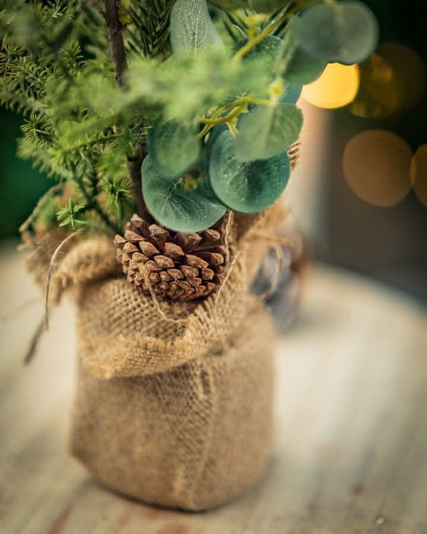 artificial-christmas-tree-with-jute-bags-burlap-sack