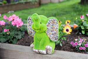Decorative elephant figure shown in garden