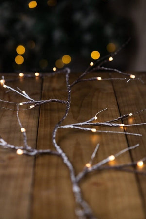 Battery operated birch garland arranged on a table