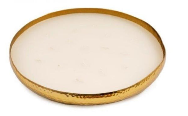 Large round candle with multiple small candles inside on a white background