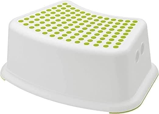 Plastic footstool positioned beside a bathroom sink