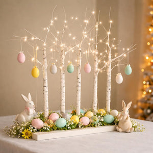 Battery operated twig tree glowing on a table