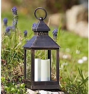 Battery powered LED flickering candle lantern with timer