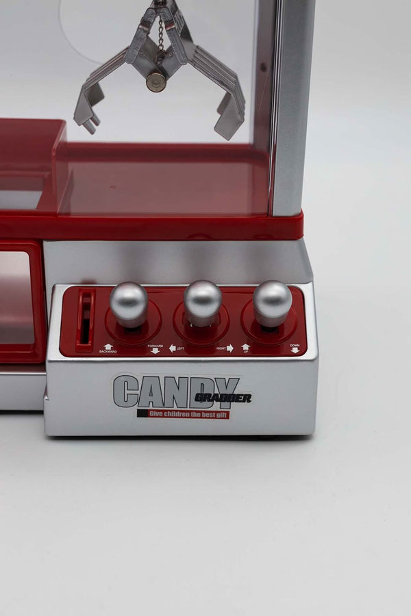 Interactive sweet grabber machine with movable claw