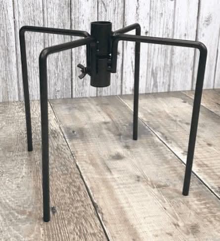 Steel bird feeder support positioned in soil