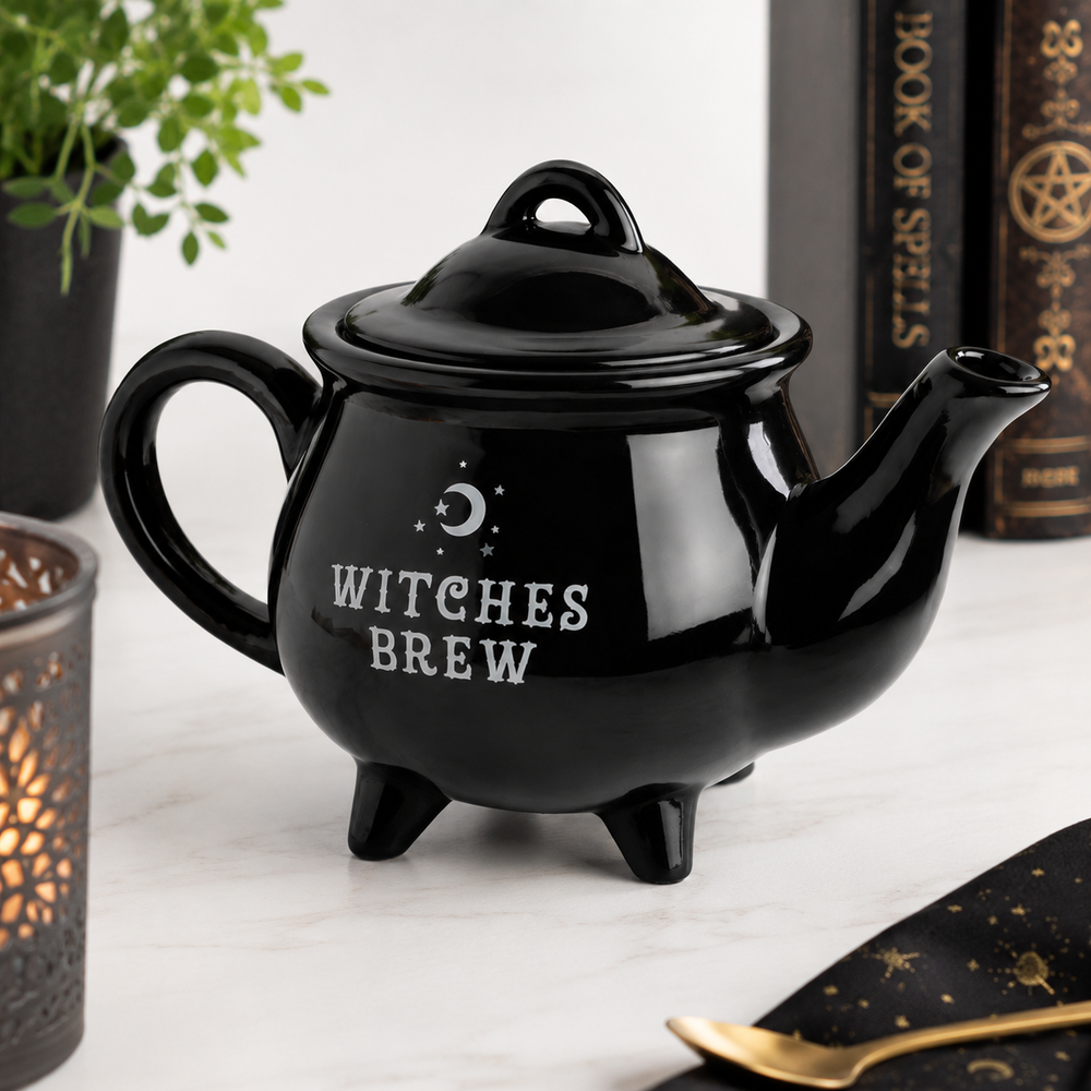 Black cauldron teapot featuring Witches Brew design