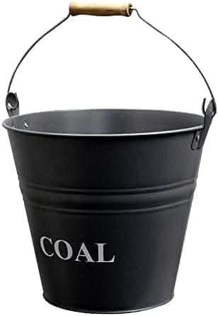Coal storage bucket positioned beside a fireplace