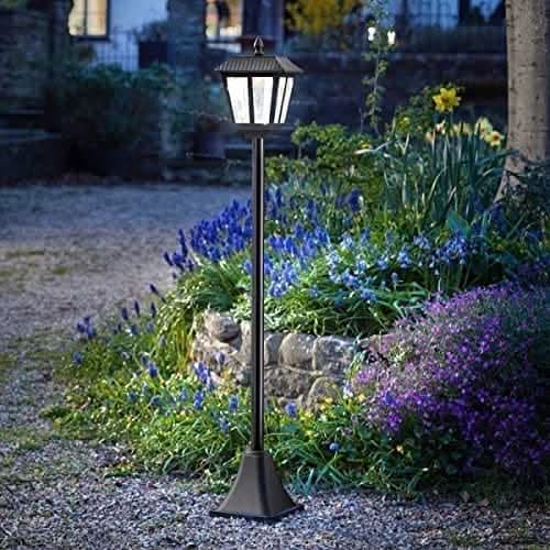 Black traditional solar lamp post displayed outdoors