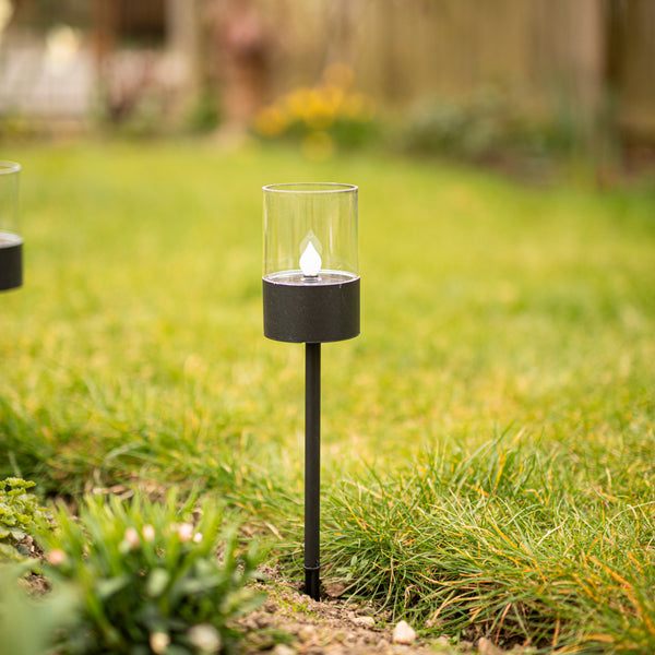 Black garden ground spike light shown close up